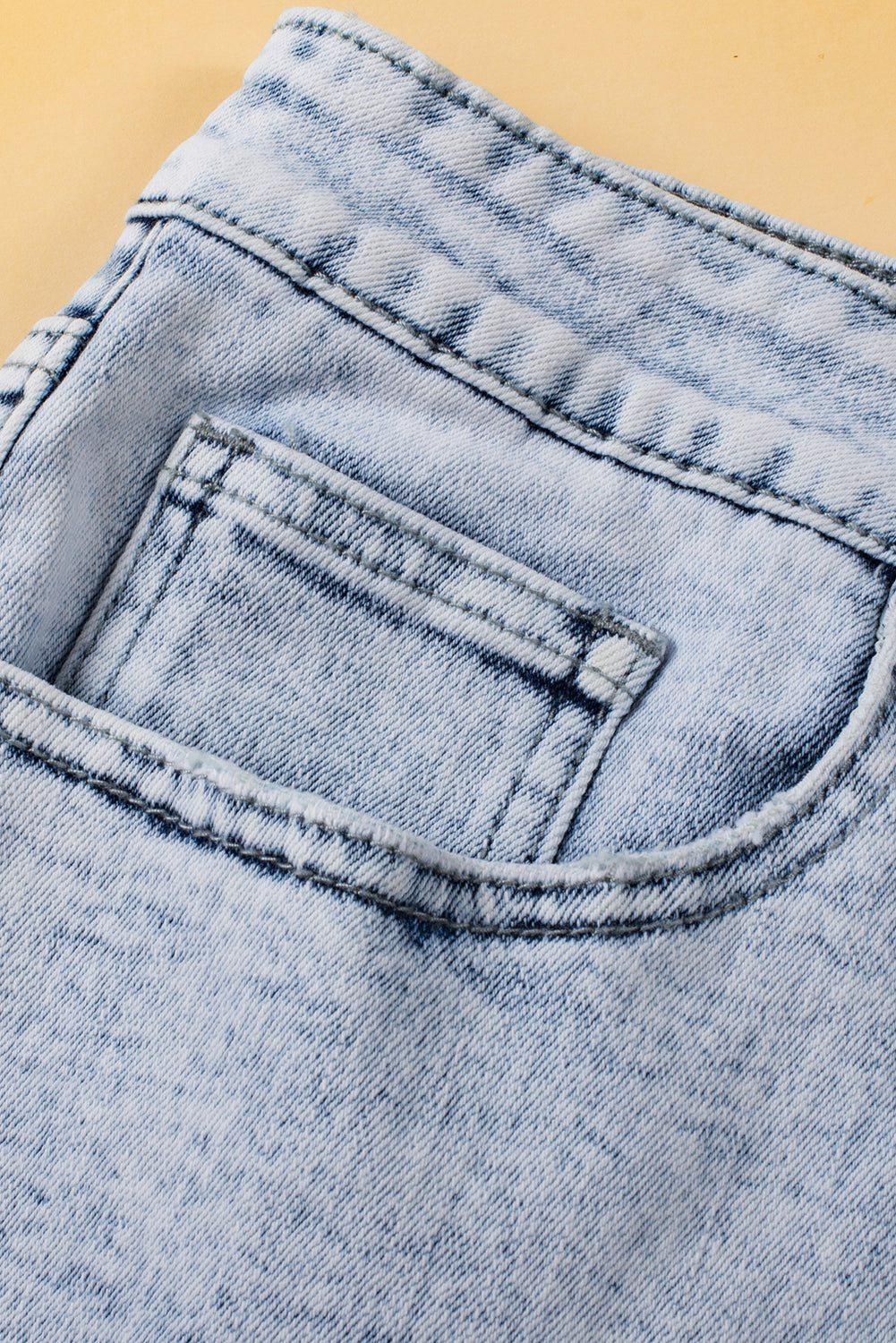 Light Blue Acid Wash Crossed Raw Edge Denim Shorts-Bella Boutique Collective